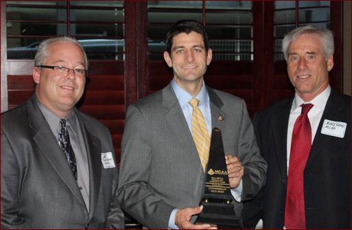 Congressman Paul Ryan of Wisconsin accepts the Freedom and Prosperity Award. Shown are Jeff Buczkiewicz, Paul Ryan and Mark Kemp.