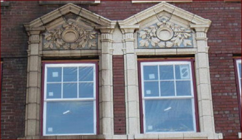 Midwest Pressure Washing & Restoration repaired this terra cotta ornament as part of their restoration of the Dalton Apartment masonry exterior.  Photo courtesy Midwest Pressure Washing