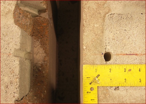Top of grout-filled concrete masonry wall close-edge distance. Right: Anchor hole before installation and testing. Left: After testing, face of block wall is detached from grout.