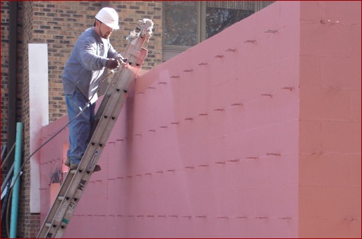 A fluid-applied air and water barrier is applied to CMU back-up on an addition at United Methodist Church, New Lenox, Ill. The installer is a pressure-washing company sub-contractor, but there is no reason the work couldn’t have been done by the mason contractor.