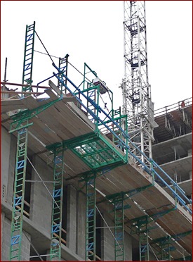 Photo 4: Materials are brought up through Non-Stop’s Trap-Door with a Betamax hoist.