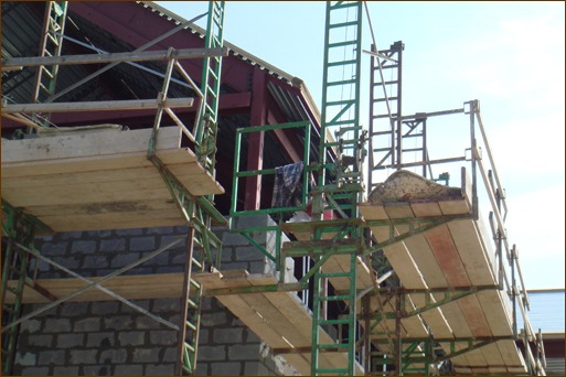Photo 3: Guardrails, end rails, and safe access are always in place on crank-up style scaffolding. The towers are legal to climb.