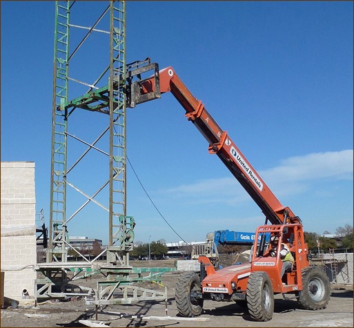 Photo 6: A distinct advantage of crank-up type scaffolding is moving the towers from wall to wall intact. You eliminate the time, labor, and hazards of tear down and re-building frame scaffolding.