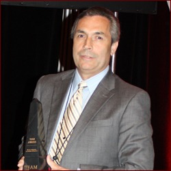 Carl Lee from Masonry and Ceramic Tile Institute of Oregon accepting Rehabilitation, Restoration award on behalf of Pioneer Waterproofing Company, Inc. for  Oregon State Hospital Kirkbride Building