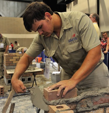 Caleb Soley, the fourth of four Soley Brothers to compete in the National Masonry Contest held in conjunction with the annual SkillsUSA Leadership and Skills Conference, works to complete his composite project this past June. Each of Porter Soley's sons placed between fourth and eight place in the national contests in which each participated.