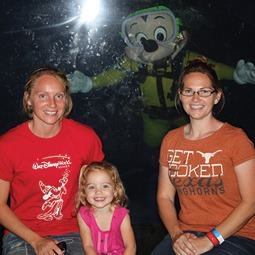 Valerie Bounds (left), Lila Bounds (center), Marilyn Bounds (right) with Mickey Mouse during the MCAA Closing dinner at the Living Seas Salon at Epcot.