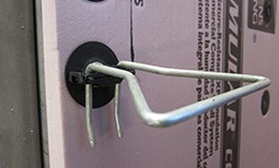 Thermally efficient single barrel veneer anchor including thermal break technology and air barrier sealing washer. Thermally efficient single barrel veneer anchor including thermal break technology and air barrier sealing washer.