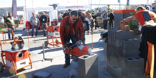Franklin Wagner demonstrates a saw from IQ Power Tools that collects nearly 100% of the dust while it cuts.