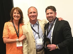  Presentation of the 2016 BSI Person of the Year award to Rob Barnes (right), Dee Brown Co., by MIA+BSI executive vice president Jane Bennett (left) and 2014 POTY award recipient Daniel Wood (center), Lurvey Landscape Supply.