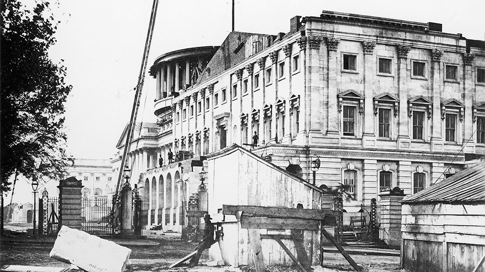 Shown is the east front of the Capitol Building, Senate Extension, before construction of the portico, with the cast iron dome under construction. c.1863.