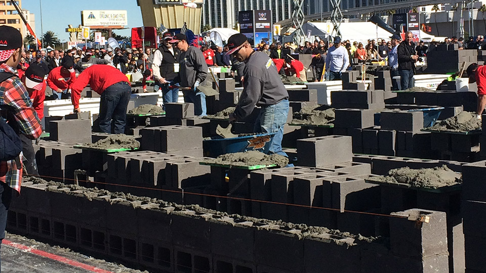 Journeyman masons and their tenders compete in a 20-minute heat in the Fastest Trowel on the Block competition.