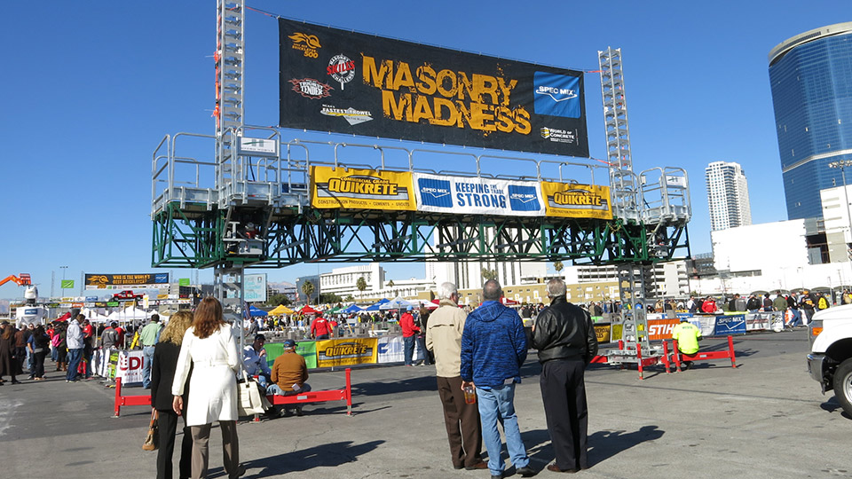 Spectators walk into the Masonry Madness area of the Gold Lot to watch the day’s competitions.